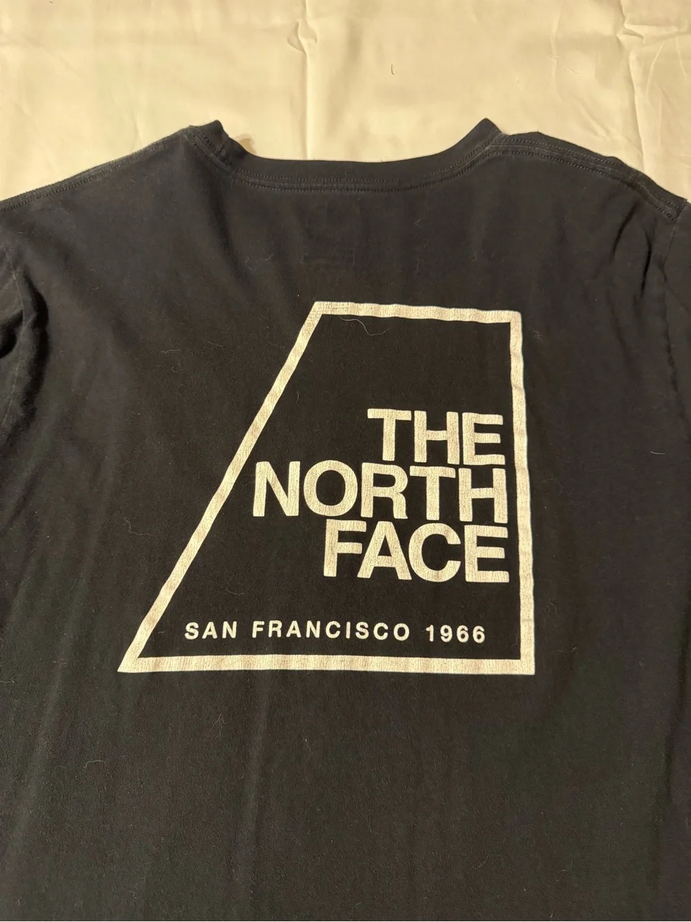 The North Face Black Long Sleeve Tee with Blue Logo Patch